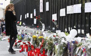 People leave flowers and light candles in tribute to the 13 November attacks in Paris outside the French Embassy in Madrid, Spain, 15 November 2015. At least 129 people have been killed in a series of attacks in Paris, France on 13 November 2015, according to French officials. Eight assailants were killed, seven when they detonated their explosive belts, and one when he was shot by officers, police said. EFE/Victor Lerena